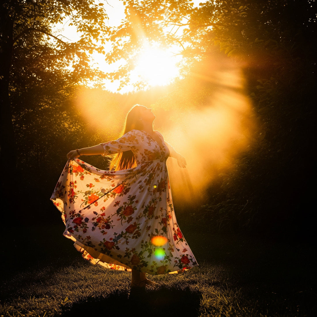 woman in dress feeling sun's energy
