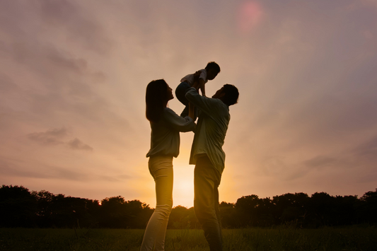 silhouette of family at sunset